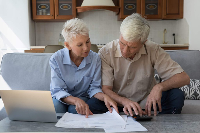 Two seniors with laptop