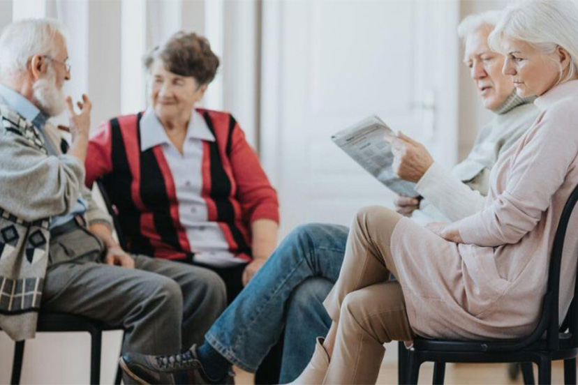 Senior adults socialize in assisted living home