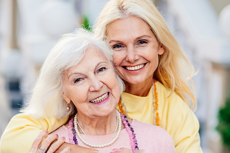Woman and daughter hugging