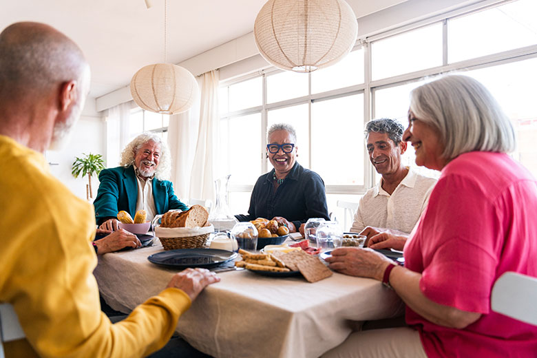 Group of older adults eating together