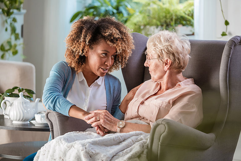 Home nurse looks after elderly woman