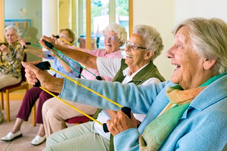 Seniors exercising in group workout class